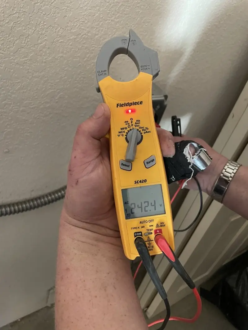 Voltage testing with clamp meter during Outlet Installation in Peoria
